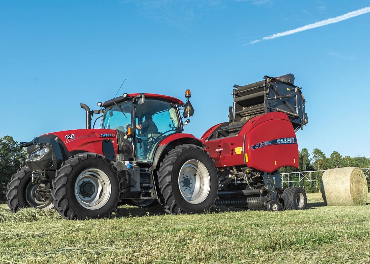 Red Case IH Maxxum 125 tractor shown performing field work, highlighting its mid-range horsepower and versatility for farming operations